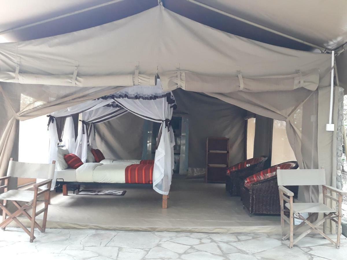 Отель Enchoro Wildlife Camp Ololaimutiek Экстерьер фото