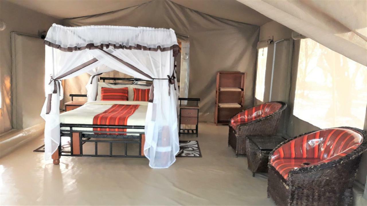 Отель Enchoro Wildlife Camp Ololaimutiek Экстерьер фото